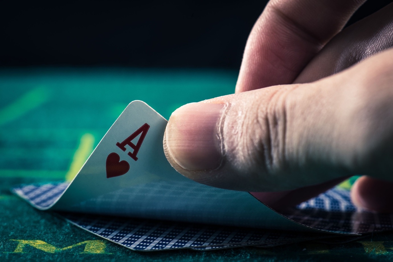 A hand holding a card Description automatically generated with medium confidence