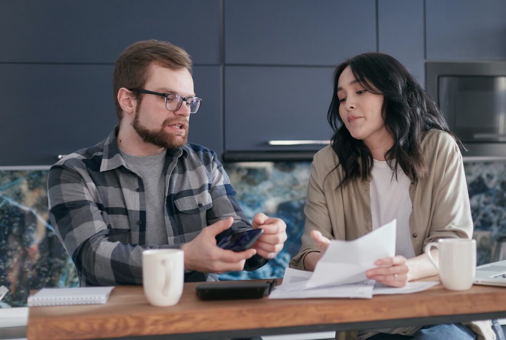 A Man Talking while Looking at a Document