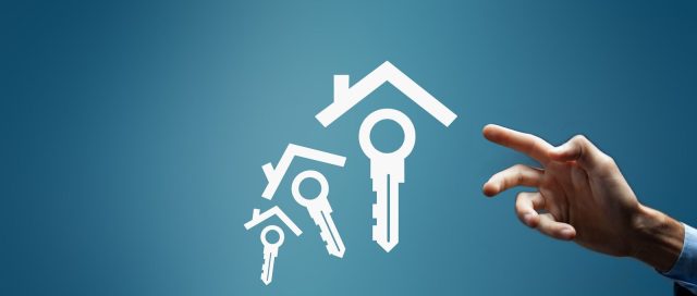 Hand reaching for house and key icons on blue background